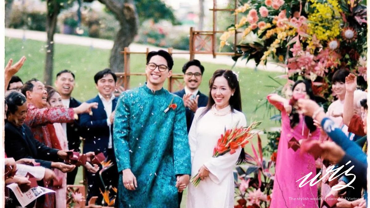 A sunny outdoor wedding celebration in Vietnam, highlighting seasonal budget factors for a vietnam destination wedding cost